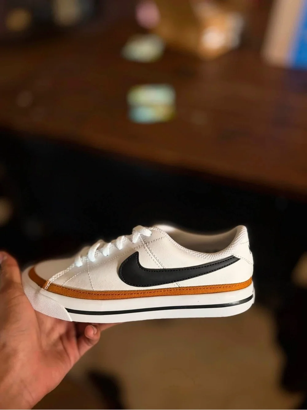 4Y or 5.5W Nike Kids White Sneakers with Black Swoosh and Gold Accent